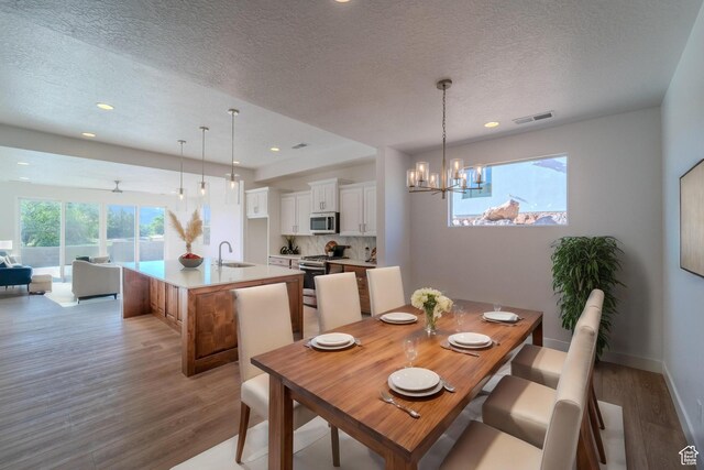 723 S 1220 W Unit 34, Hurricane, UT 84737 - dining space featuring light wood-type flooring, visible vents, a notable chandelier, and recessed lighting
