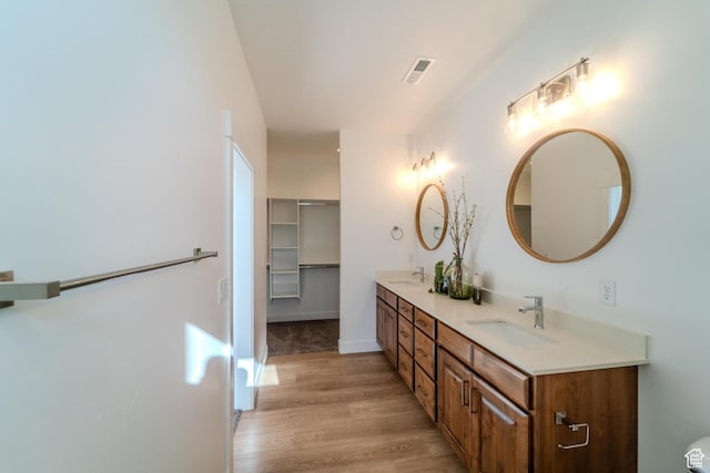 723 S 1220 W Unit 34, Hurricane, UT 84737 - full bathroom with double vanity, visible vents, a sink, and wood finished floors