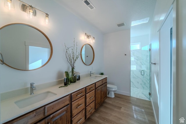 723 S 1220 W Unit 34, Hurricane, UT 84737 - bathroom featuring visible vents, a sink, a marble finish shower, and wood finished floors