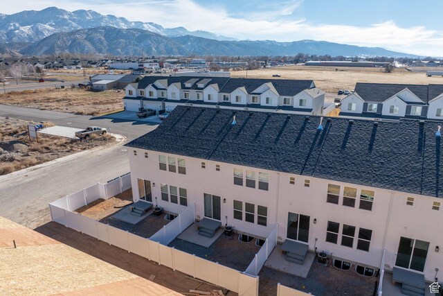 drone / aerial view with a residential view and a mountain view