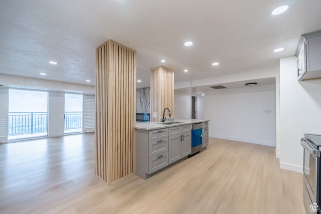 875 S Donner Way Unit 1203, Salt Lake City, UT 84108 - kitchen featuring gray cabinets, light hardwood / wood-style floors, light stone counters, sink, and stainless steel range with electric stovetop