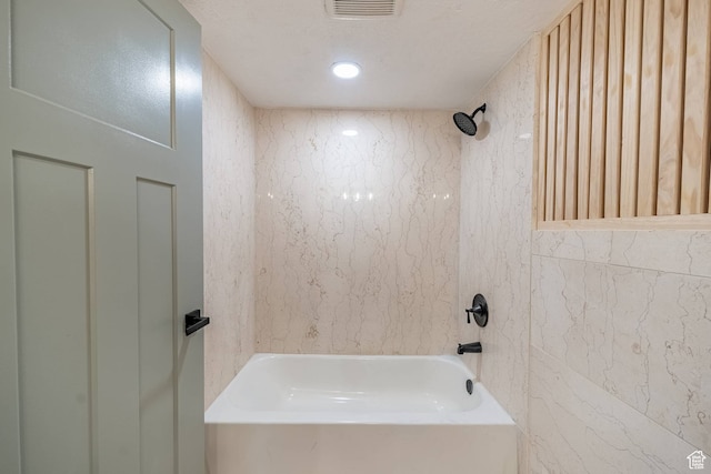 875 S Donner Way Unit 1203, Salt Lake City, UT 84108 - bathroom featuring tiled shower / bath and a textured ceiling