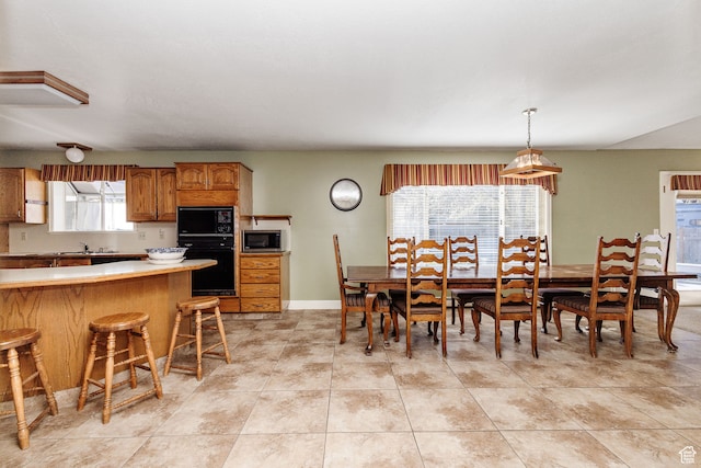 1560 E 1580 N, Logan, UT 84341 - dining area featuring sink and light tile floors