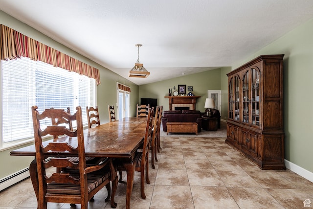 1560 E 1580 N, Logan, UT 84341 - dining area featuring a baseboard radiator, vaulted ceiling, and light tile floors