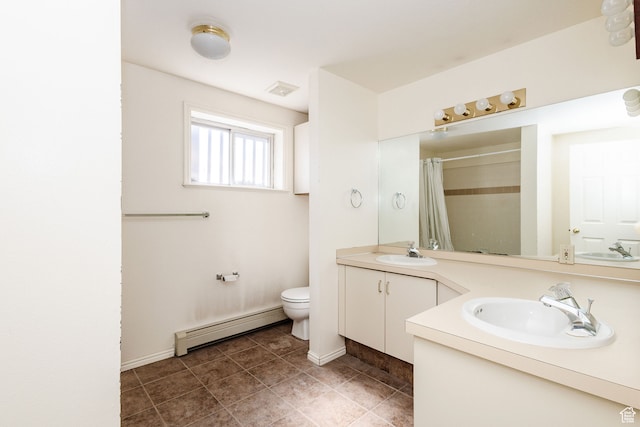 1560 E 1580 N, Logan, UT 84341 - bathroom featuring baseboard heating, toilet, oversized vanity, and tile flooring