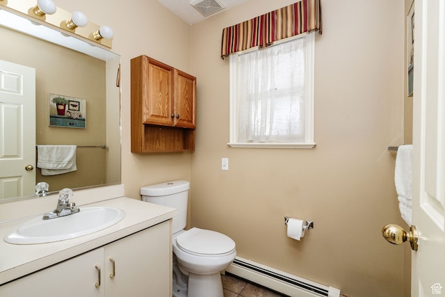 1560 E 1580 N, Logan, UT 84341 - bathroom featuring tile flooring, vanity with extensive cabinet space, toilet, and baseboard heating