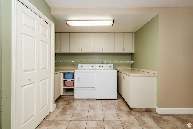 1560 E 1580 N, Logan, UT 84341 - laundry room with cabinets, light tile floors, and washing machine and clothes dryer