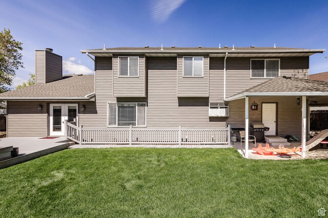 1560 E 1580 N, Logan, UT 84341 - back of property with a patio area and a lawn