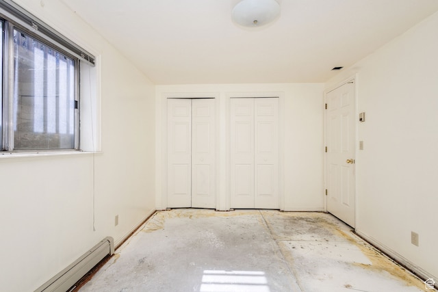 1560 E 1580 N, Logan, UT 84341 - unfurnished bedroom featuring two closets and baseboard heating