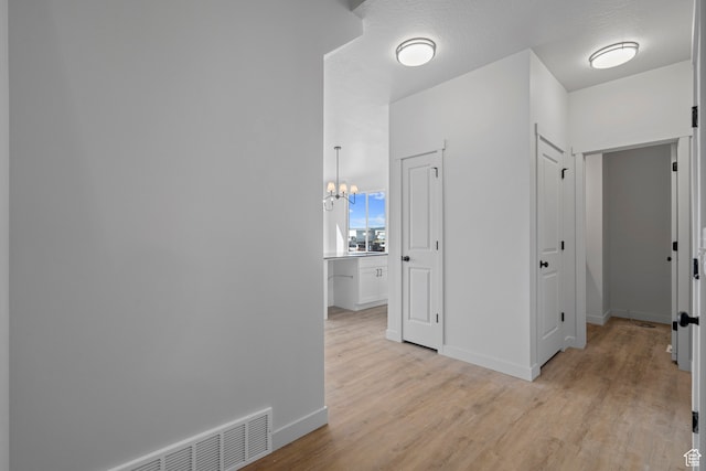 108 W 1320 N, Nephi, UT 84648 - corridor featuring light wood-style flooring and a chandelier