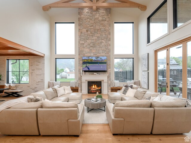 616 E Stokes Ave S, Draper, UT 84020 - living room with hardwood / wood-style floors, beamed ceiling, high vaulted ceiling, and plenty of natural light