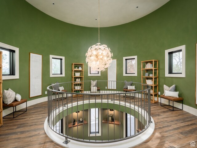 616 E Stokes Ave S, Draper, UT 84020 - corridor featuring dark hardwood / wood-style flooring, a towering ceiling, and a notable chandelier