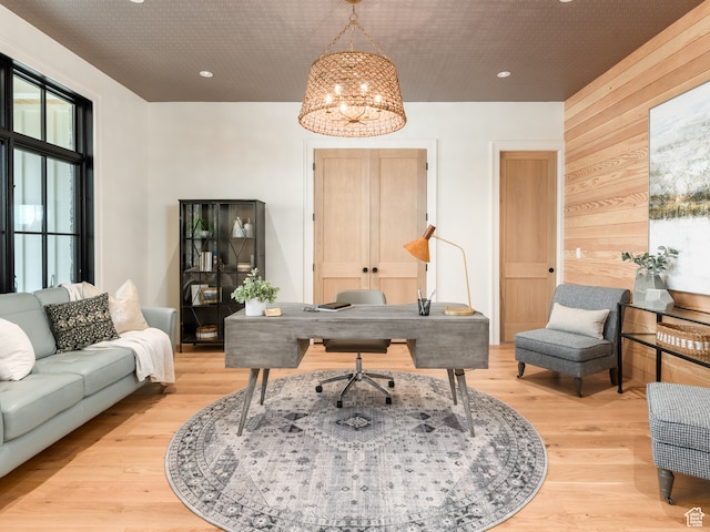 616 E Stokes Ave S, Draper, UT 84020 - home office featuring wood walls, a notable chandelier, and light wood-type flooring