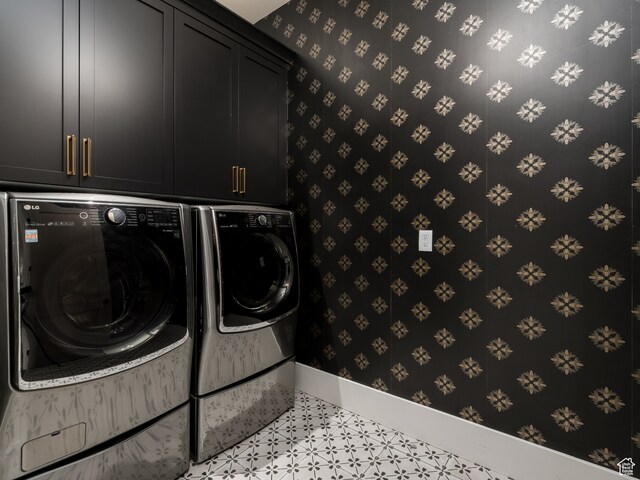 616 E Stokes Ave S, Draper, UT 84020 - clothes washing area featuring cabinets, light tile floors, and washing machine and clothes dryer