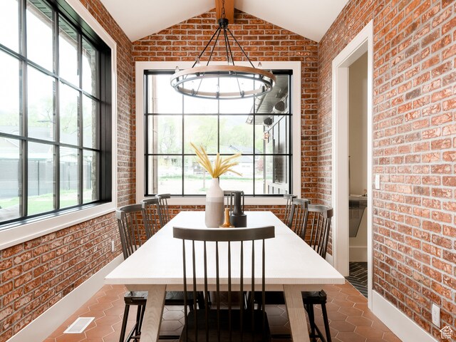 616 E Stokes Ave S, Draper, UT 84020 - tiled dining area with lofted ceiling with beams and brick wall