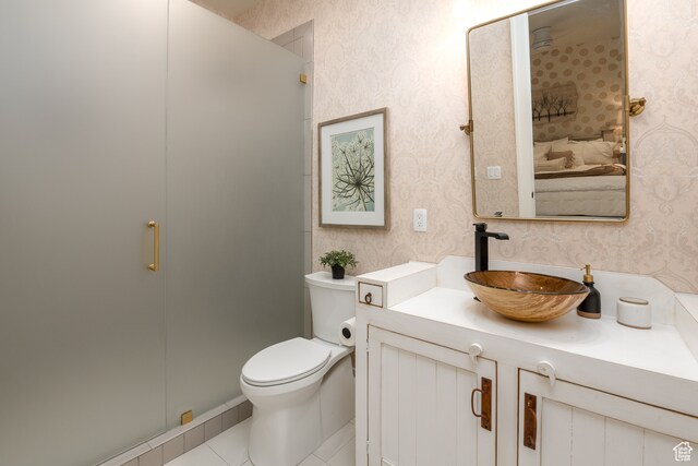 616 E Stokes Ave S, Draper, UT 84020 - bathroom featuring tile floors, vanity, toilet, and walk in shower