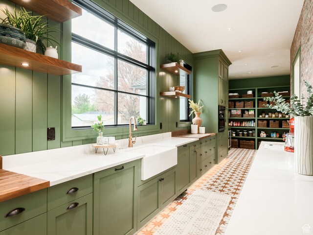 616 E Stokes Ave S, Draper, UT 84020 - interior space featuring plenty of natural light, sink, green cabinets, and tile flooring