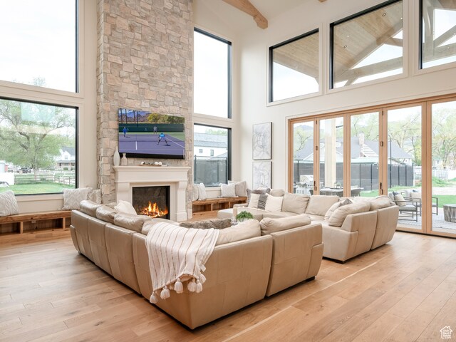 616 E Stokes Ave S, Draper, UT 84020 - living room with a wealth of natural light, a towering ceiling, and light wood-type flooring