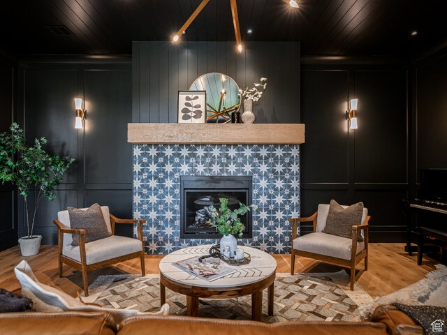 616 E Stokes Ave S, Draper, UT 84020 - living room with wood ceiling, wood-type flooring, and a tile fireplace
