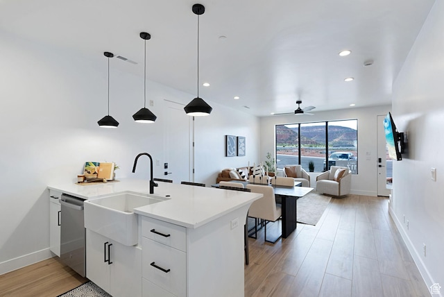 400 S Moki Dr Unit I-1, Kanab, UT 84741 - kitchen with stainless steel dishwasher, light wood-style flooring, recessed lighting, light countertops, and hanging light fixtures