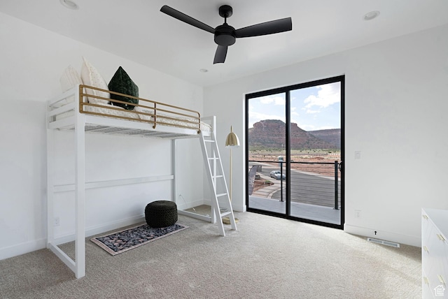 400 S Moki Dr Unit I-1, Kanab, UT 84741 - unfurnished bedroom featuring carpet, access to outside, ceiling fan, and a mountain view
