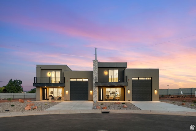 400 S Moki Dr Unit I-1, Kanab, UT 84741 - contemporary home featuring a balcony, concrete driveway, and a garage