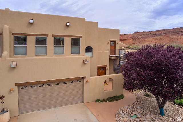 1145 E Bonita St, Moab, UT 84532 - southwest-style home featuring a mountain view and a garage