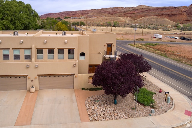 1145 E Bonita St, Moab, UT 84532 - view of front facade featuring a garage and a mountain view