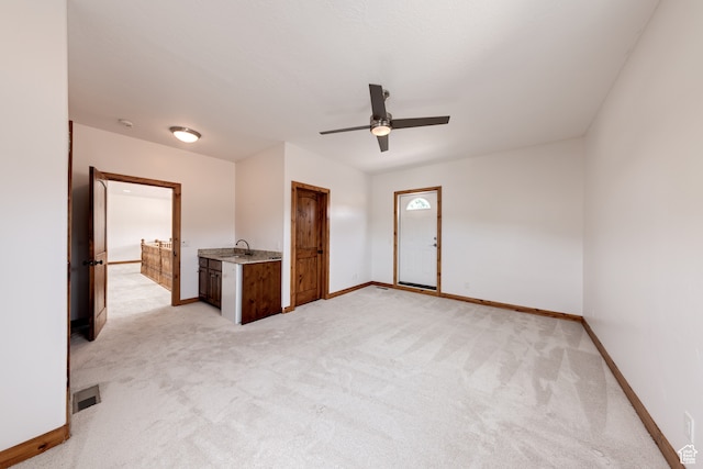 1145 E Bonita St, Moab, UT 84532 - unfurnished room featuring light colored carpet, ceiling fan, and sink