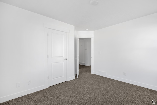 1698 S Marigold Unit 242, Santaquin, UT 84655 - spare room featuring dark colored carpet and baseboards