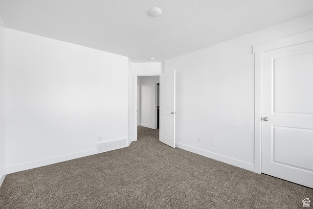 1698 S Marigold Unit 242, Santaquin, UT 84655 - unfurnished bedroom with carpet floors, baseboards, and a textured ceiling