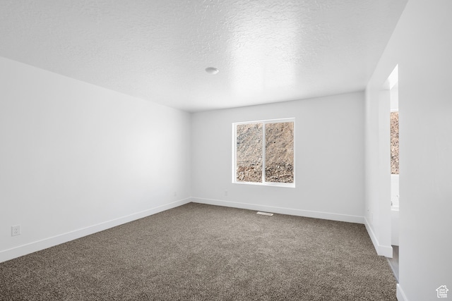 1698 S Marigold Unit 242, Santaquin, UT 84655 - spare room with dark carpet, a textured ceiling, and baseboards