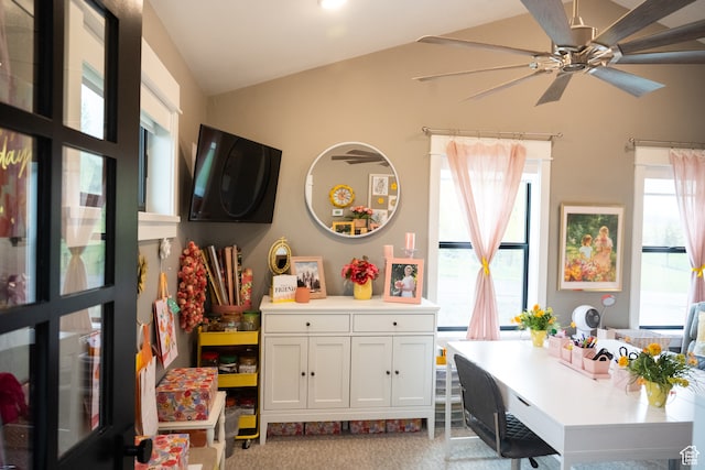recreation room with a ceiling fan, vaulted ceiling, and light carpet