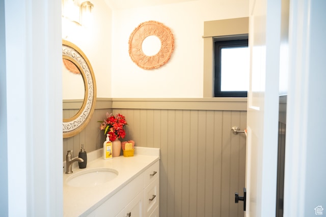 bathroom featuring wainscoting and vanity