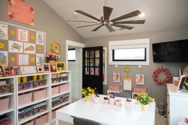 game room with ceiling fan and vaulted ceiling