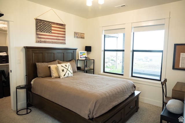bedroom with carpet flooring, baseboards, and visible vents