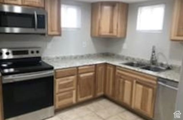 390 N 100 E, Spanish Fork, UT 84660 - kitchen featuring sink, appliances with stainless steel finishes, light tile floors, and a wealth of natural light