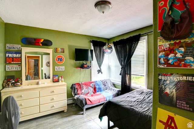 390 N 100 E, Spanish Fork, UT 84660 - bedroom featuring a baseboard heating unit and a textured ceiling