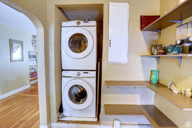 390 N 100 E, Spanish Fork, UT 84660 - laundry area featuring stacked washer / dryer and light hardwood / wood-style floors