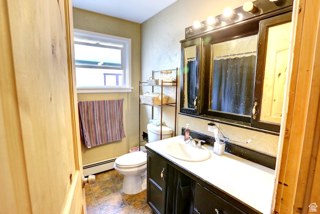 390 N 100 E, Spanish Fork, UT 84660 - bathroom featuring toilet, vanity with extensive cabinet space, baseboard heating, and tile flooring