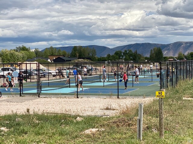 888 N Newburg Dr Unit 1, Garden City, UT 84028 - surrounding community with a mountain view and a tennis court