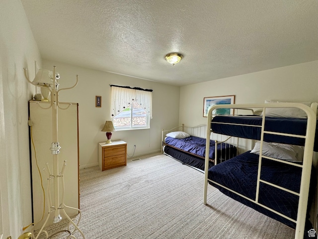 888 N Newburg Dr Unit 1, Garden City, UT 84028 - bedroom featuring carpet floors, a textured ceiling, and baseboards