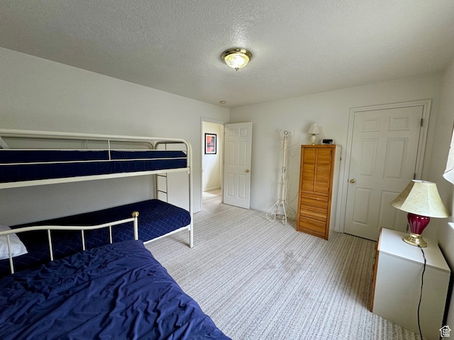 888 N Newburg Dr Unit 1, Garden City, UT 84028 - carpeted bedroom with a textured ceiling