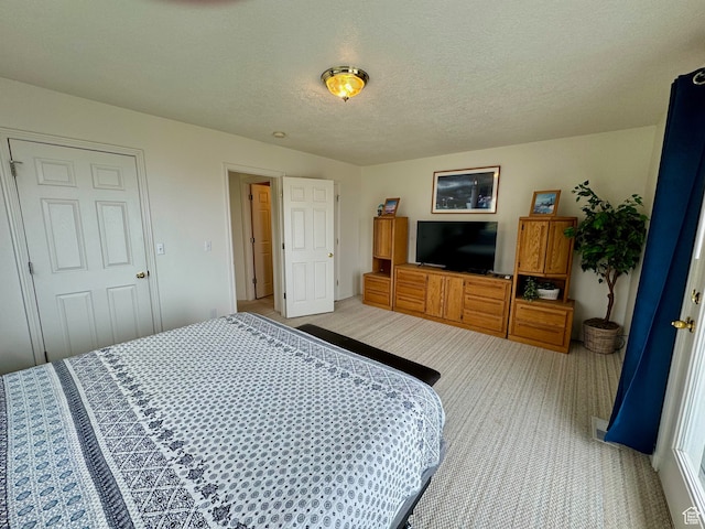 888 N Newburg Dr Unit 1, Garden City, UT 84028 - bedroom with light colored carpet and a textured ceiling