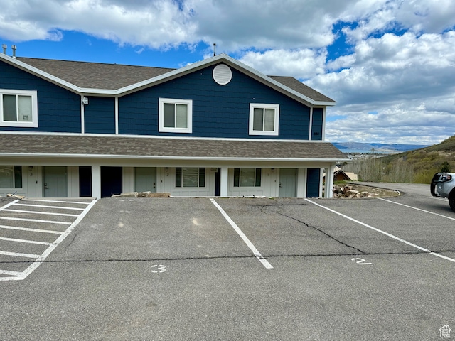 888 N Newburg Dr Unit 1, Garden City, UT 84028 - view of front of house featuring uncovered parking and a shingled roof