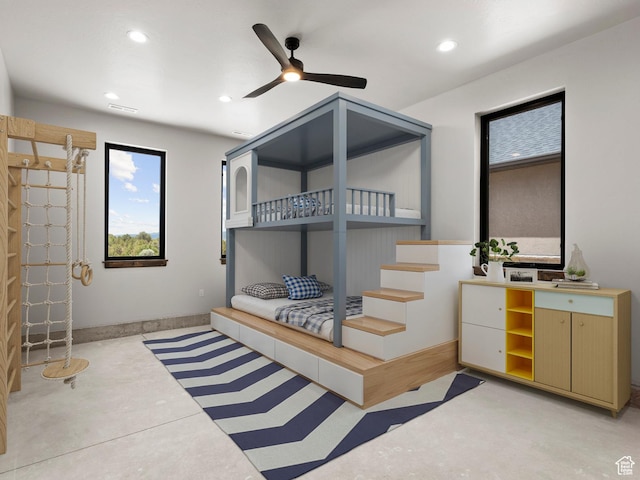 bedroom with concrete flooring, visible vents, baseboards, and recessed lighting
