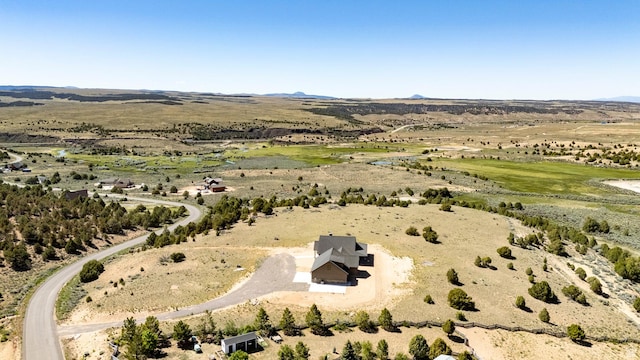 birds eye view of property featuring a rural view