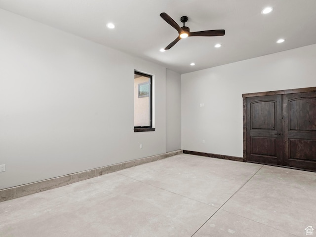 empty room featuring concrete flooring, ceiling fan, baseboards, and recessed lighting
