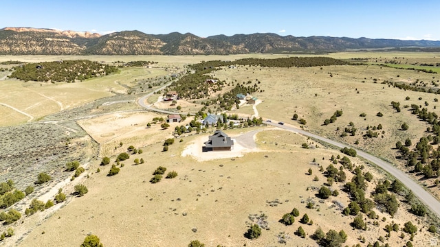 drone / aerial view featuring a mountain view and a rural view