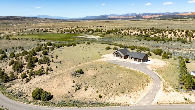 drone / aerial view featuring a rural view and a mountain view